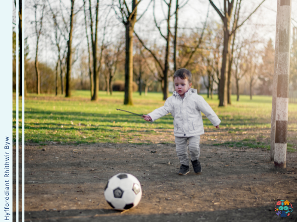 Child plays with a football