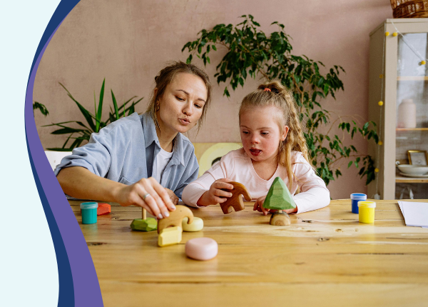 Additional Learning Needs Training An adult and child playing with wooden toys