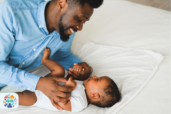 Adult playing with a baby