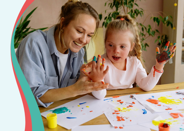 Capable Environments pt 2 Adult helping child painting