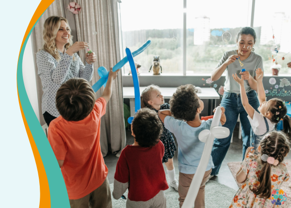 Curriculum for funded non-maintained nursery settings’ Children in a childcare setting playing with bubbles