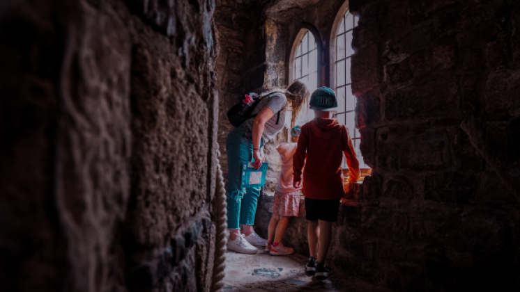 family enjoying visit to castle in wales