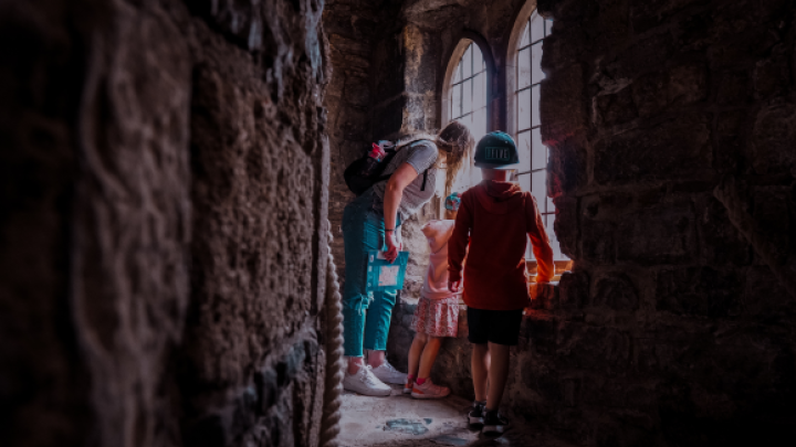 family enjoying visit to castle in wales