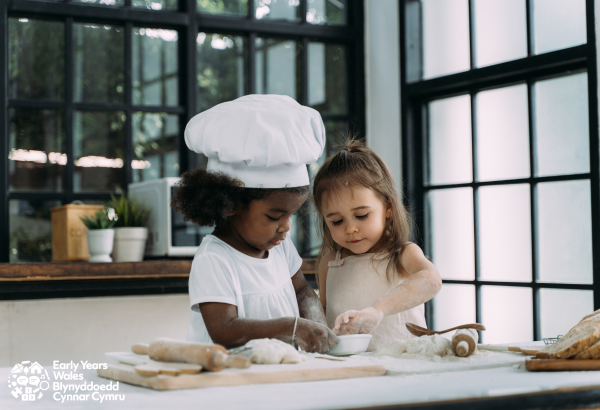 picture is of two little girls baking together