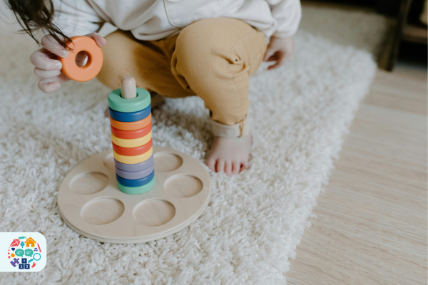 Image of a child stacking coloured wooden circles