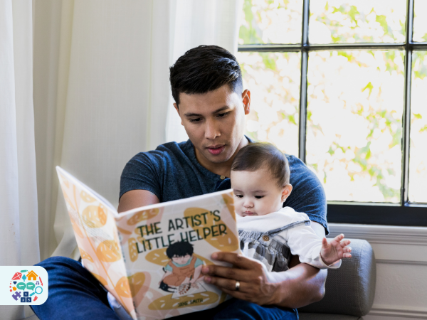 Adult reading a book to a baby