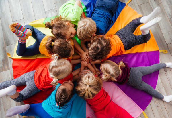 Children laying in a circle