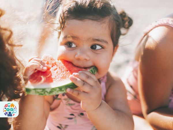 Child eating a slice of watermelon