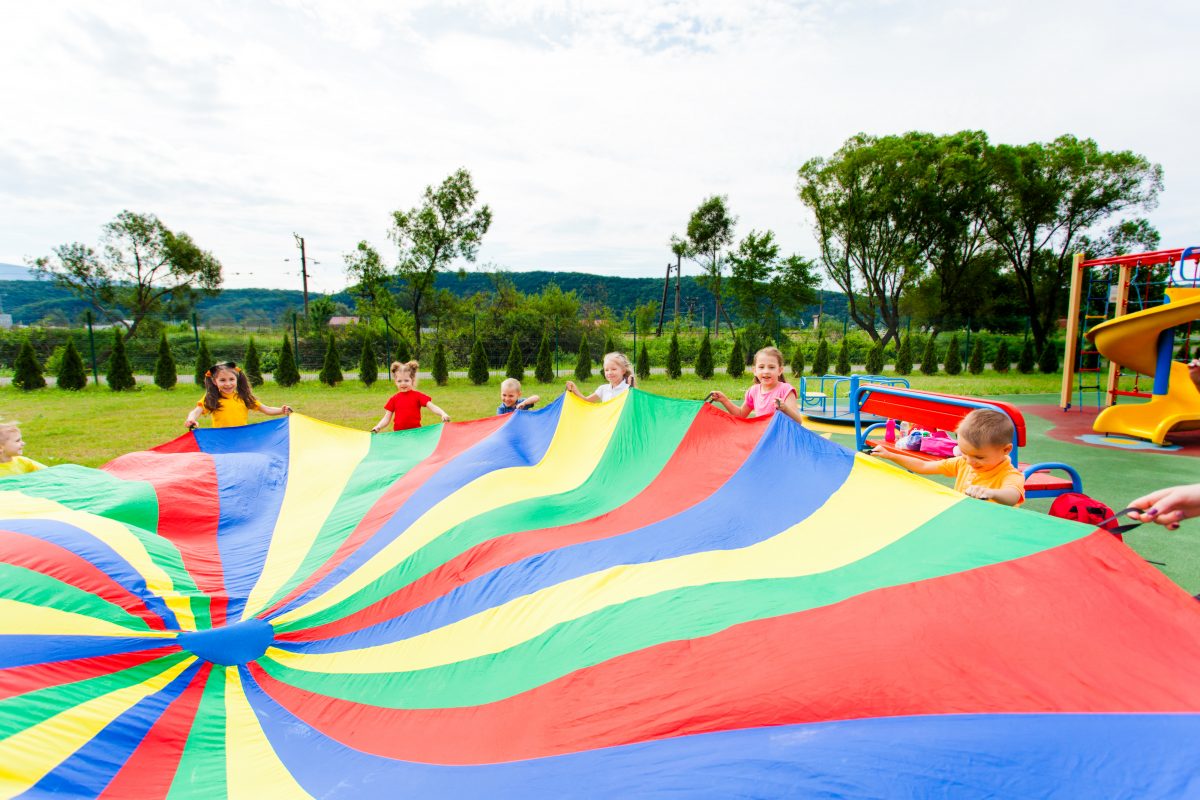 children playing with parachute