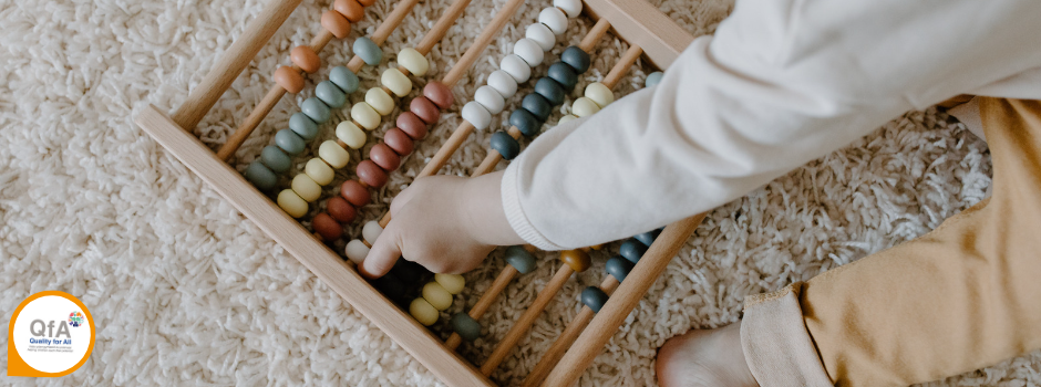 Child playing with an abacus