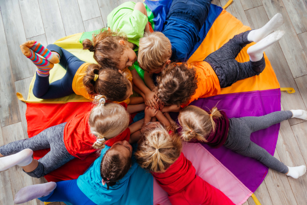 Children laying in a circle