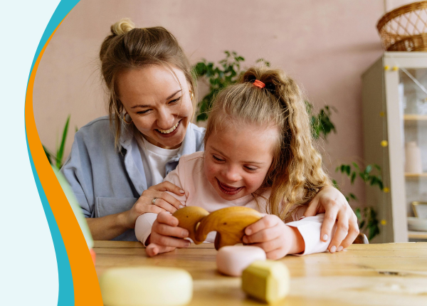 Introduction to Learning Disability An adult helping a child with painting using their hands