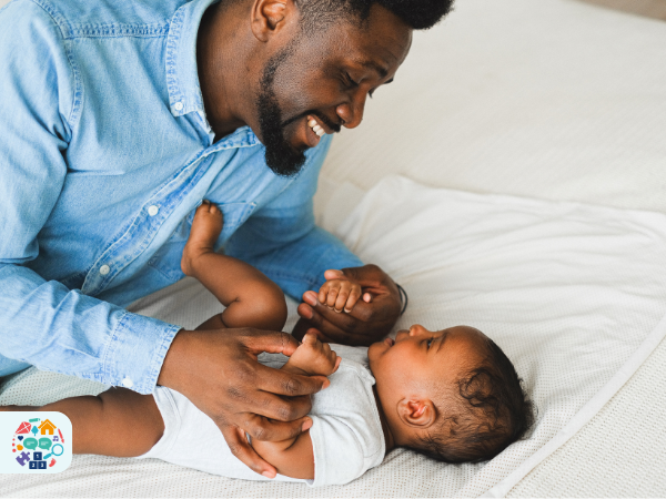 Adult playing with a baby