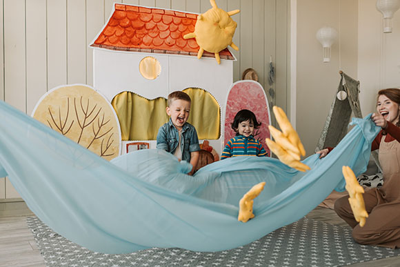 Children playing with a parachute