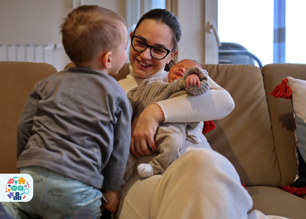 Adult with a baby and child