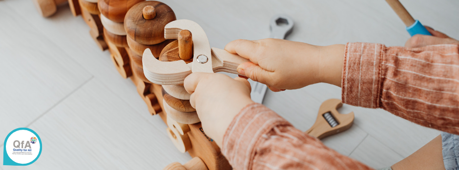 Child playing with tools