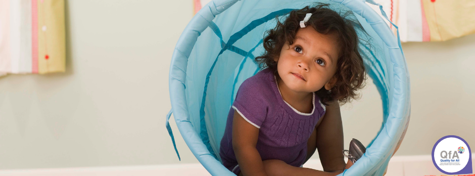 Support Child smiling while sitting in tube