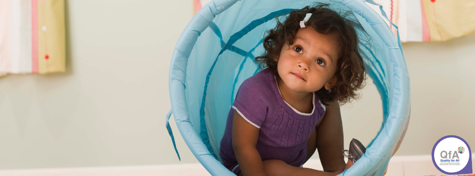 Child smiling while sitting in tube