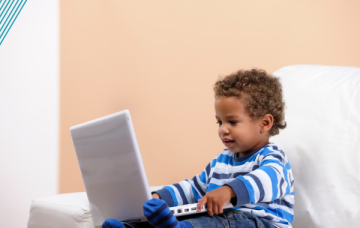 Child looking at laptop