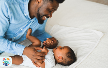 Adult playing with a baby