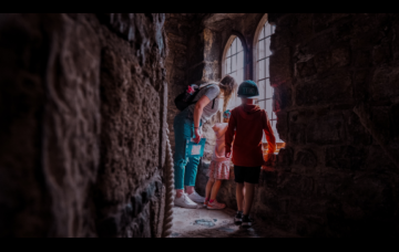 family enjoying visit to castle in wales