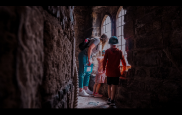 family enjoying visit to castle in wales