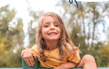 Early Years Wales; Empowering Wales' early years sector in a time of challenge and change The image shows the front cover of Early Years Wales' Annual Report 2024/25