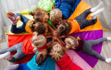 Children laying in a circle