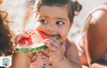 Child eating a slice of watermelon