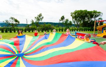 children playing with parachute