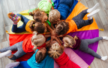 Children laying in a circle