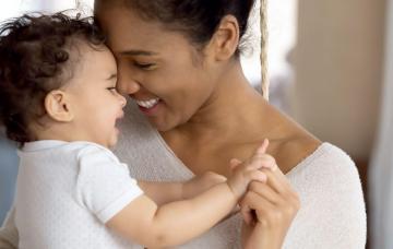 mother lovingly holding baby