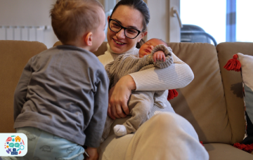 Adult with a baby and child