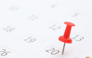 A pin highlighting a date on a calendar