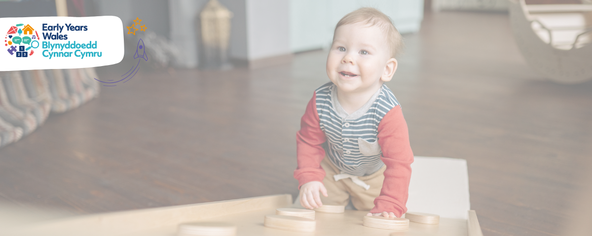 Toddler crawling up wooden platform