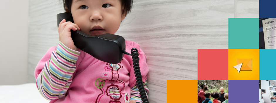 Welsh Language Support Colourful boxes on a background of a beautiful toddler wearing a pink romper holding a phone