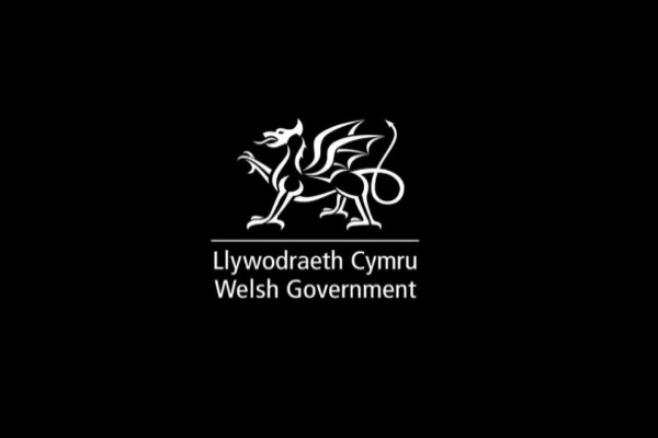 Welsh Government white on black logo